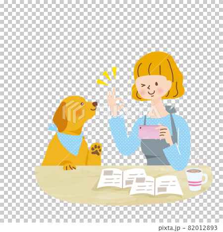 Young woman playing with a dog with a smartphone 82012893