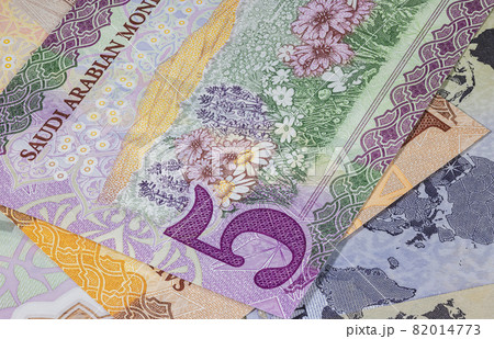 Close up photography of Saudi Arabian money. Paper Currency of Saudi Arabia. Saudi Riyal with the portrait of King Salman. Monetary Authority unveiled new family of banknotes. Detailed design capture 82014773