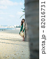 Young woman on sandy beach 82016731