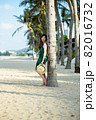 Young woman on sandy beach 82016732