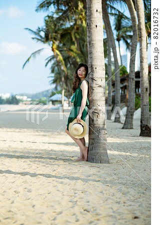 Young woman on sandy beach 82016732