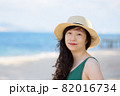 Young woman on sandy beach 82016734