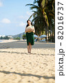 Young woman on sandy beach 82016737