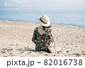Young woman on sandy beach 82016738