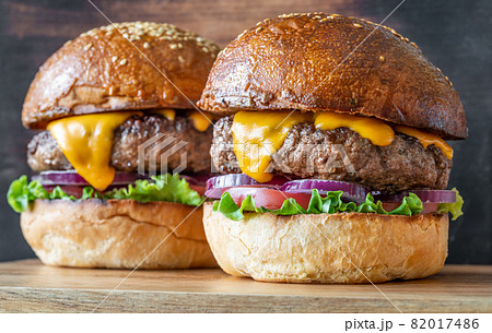 Burgers on the wooden board 82017486