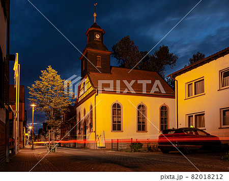 View of the historic protestant church of Walldorf in hesse during sunset 82018212