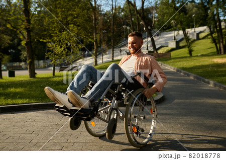 Young man in wheelchair shows his skill 82018778