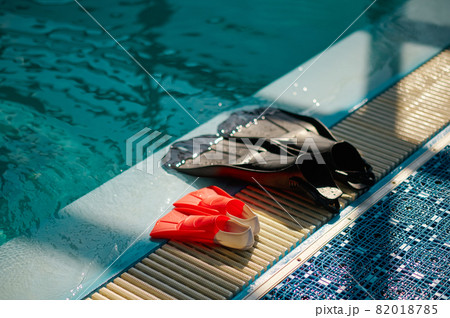 Fins at the poolside, scuba gear, diving equipment 82018785