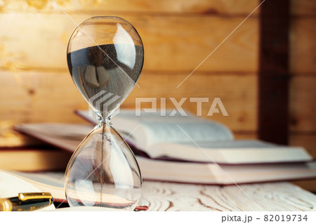 Sandglass clock close up on a table 82019734