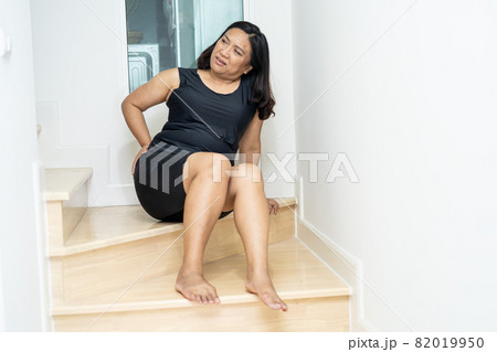 Asian middle-aged lady woman patient fall down the stairs because slippery surfaces 82019950