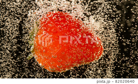 Super slow motion of strawberry falling into champagne Super slow motion of strawberry falling into champagne 82020640