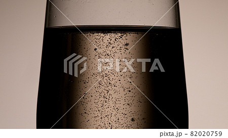 Champagne bubbles in glass flute. Champagne bubbles in glass flute. 82020759