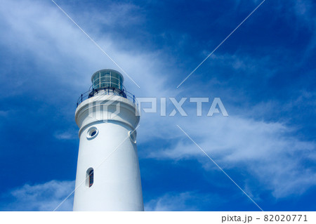 White Lighthouse Tower With Cloudy Blue Sky 82020771