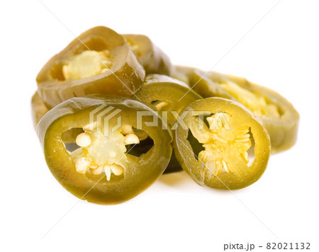 Pickled jalapeno pepper isolated on white background. Slices of preserved hot serrano. 82021132