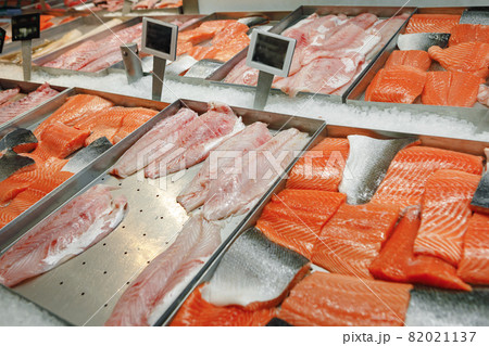 Fresh fish assorted on ice counter in supermarket 82021137