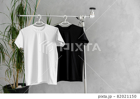 White and black T-shirts on hangers for design presentation 82021150