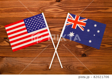 Flag of USA and flag of Australia crossed with each other. USA vs Australia. The image illustrates the relationship between countries. Photography for video news on TV and articles on the Internet and Flag of USA and flag of Australia crossed with each other. USA vs Australia. The image illustrates the relationship between countries. Photography for video news on TV and articles on the Internet and 82021706