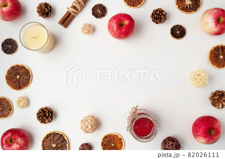 Autumn flat lay composition of apples, fall foods and decor on white background. Ingredients for jam or mulled wine. Autumn or winter holiday food concept. Creative trendy flat lay with place for text Autumn flat lay composition of apples, fall foods and decor on white background. Ingredients for jam or mulled wine. Autumn or winter holiday food concept. Creative trendy flat lay with place for text 82026111