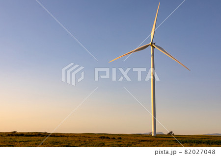General view of wind turbine in countryside landscape with cloudless sky 82027048