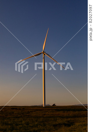 General view of wind turbine in countryside landscape during sunset General view of wind turbine in countryside landscape during sunset 82027097