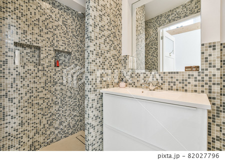 Luxury interior design of a bathroom with marble walls 82027796