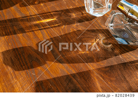 Set of perfume bottles on a bright light with shadows 82028439