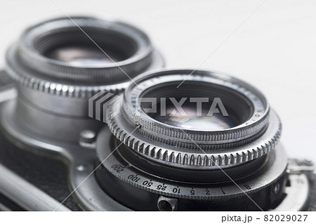 Close up of Vintage camera two lenses on white background. Close up of Vintage camera two lenses on white background. 82029027