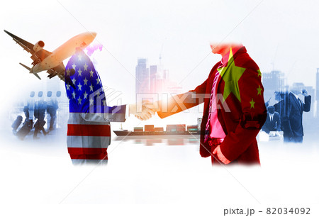 two businessman shake hands, china-usa trade war , The world logistics , logistic network distribution on background  Industrial Container Cargo freight ship for fast  instant shipping 82034092