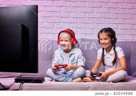 children playing video game with game console 82034988