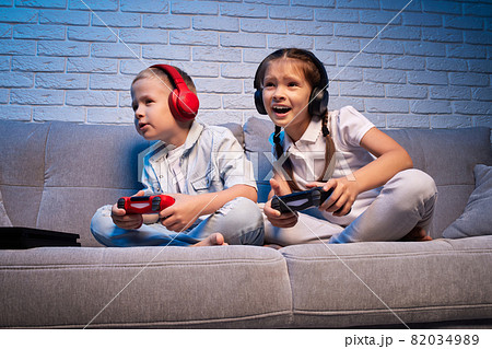 children playing video game with game console 82034989