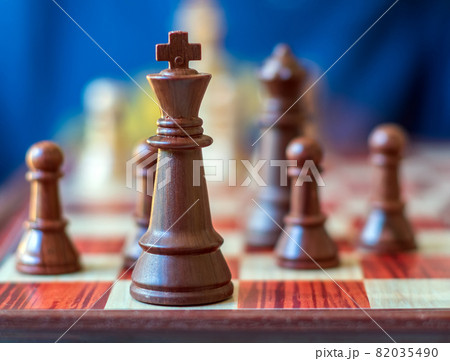 Chess pieces are standing on the board. Black chess king. Close-up. Chess pieces are standing on the board. Black chess king. Close-up. 82035490