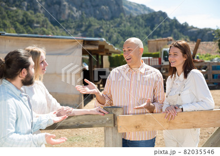 Joyful meeting of friends near the summer farm 82035546