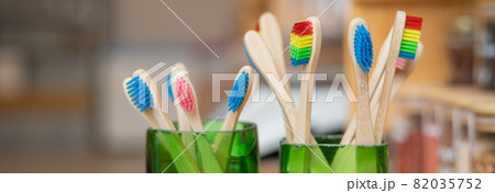 A varied selection of bamboo toothbrushes at an eco store 82035752