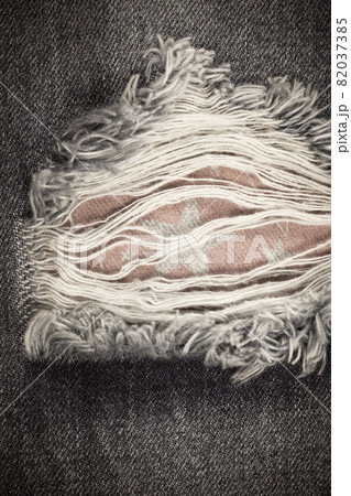 Torn denim vintage texture background. Torn denim vintage texture background. 82037385