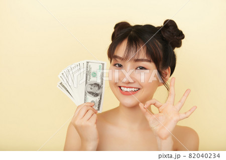 Pretty Woman Holding Money Pretty Woman Holding Money 82040234