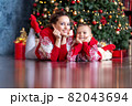 Mother and son smiling, Christmas family look 82043694