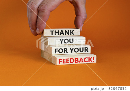 Thank you for your feedback symbol. Wooden blocks with concept words 'Thank you for your feedback'. Businessman hand. Beautiful orange background. Business and your feedback concept. Copy space. Thank you for your feedback symbol. Wooden blocks with concept words 'Thank you for your feedback'. Businessman hand. Beautiful orange background. Business and your feedback concept. Copy space. 82047852