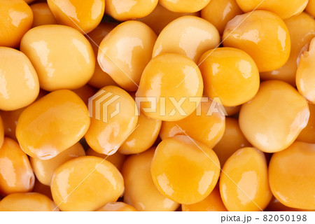 Pickled yellow lupine beans background. Tournus, preserved lupinus. 82050198