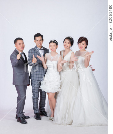 happy big family in white dress and suit on white background 82061480