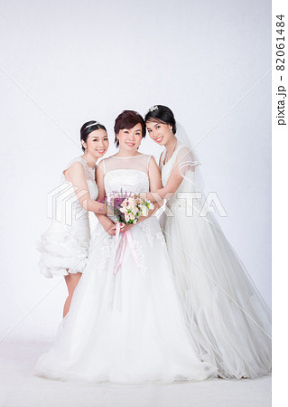 beautiful mother and cute daughters in white dress 82061484