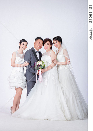 happy family in white dress and suit on white background 82061485