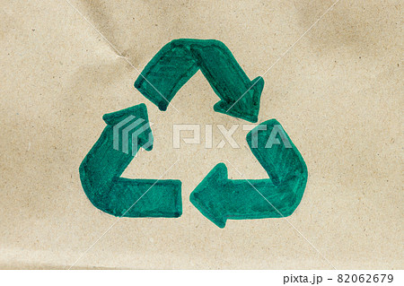 Green recycle symbol on paper cardboard background, Eco friendly and sustainability concept 82062679