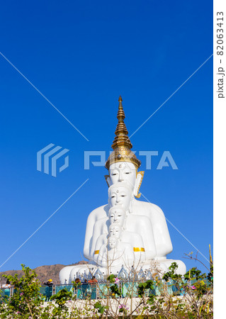 Wide view: A large white Buddha statue behind a mountain and a blue sky at Wat Pha Son Kaew, Khao Kho District, Phetchabun Province,thailand 82063413