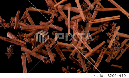 Cinnamon barks flying in the air. 82064950