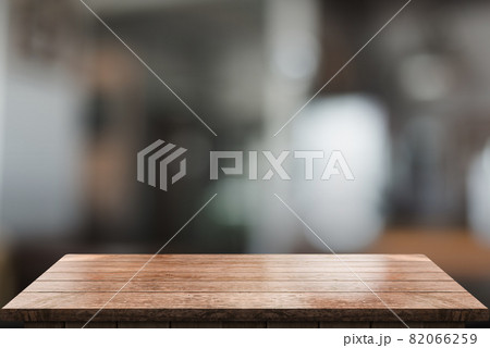Empty wooden table top with lights bokeh on blur restaurant background. Empty wooden table top with lights bokeh on blur restaurant background. 82066259