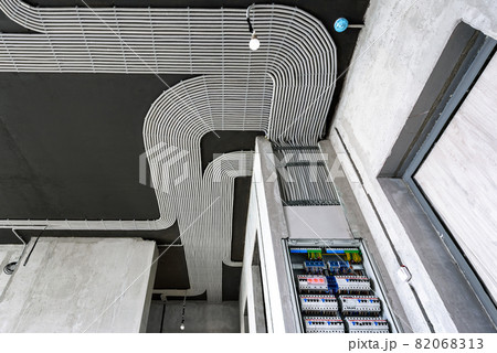 Electrical cables and switch box on ceiling and wall. Modern wiring. Electrical cables and switch box on ceiling and wall. Modern wiring. 82068313