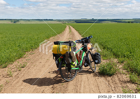 Traveler's bike on the road. 82069631