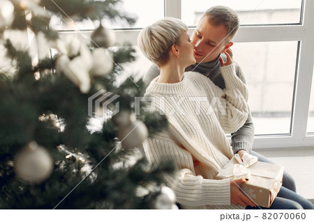 People in a winter clothes in a christmass atmosphere People in a winter clothes in a christmass atmosphere 82070060