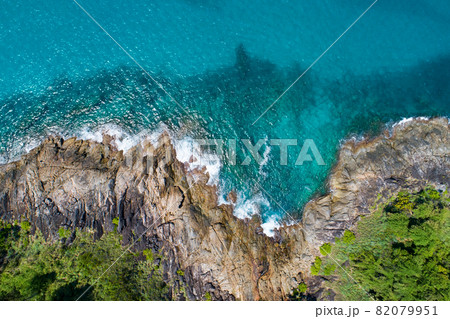 Aerial view Top down seashore wave crashing on seashore Beautiful turquoise sea surface in sunny day Good weather day summer background Amazing seascape top view Aerial view Top down seashore wave crashing on seashore Beautiful turquoise sea surface in sunny day Good weather day summer background Amazing seascape top view 82079951