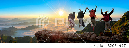 Group of happy hiker jumping on the hill Group of happy hiker jumping on the hill 82084997